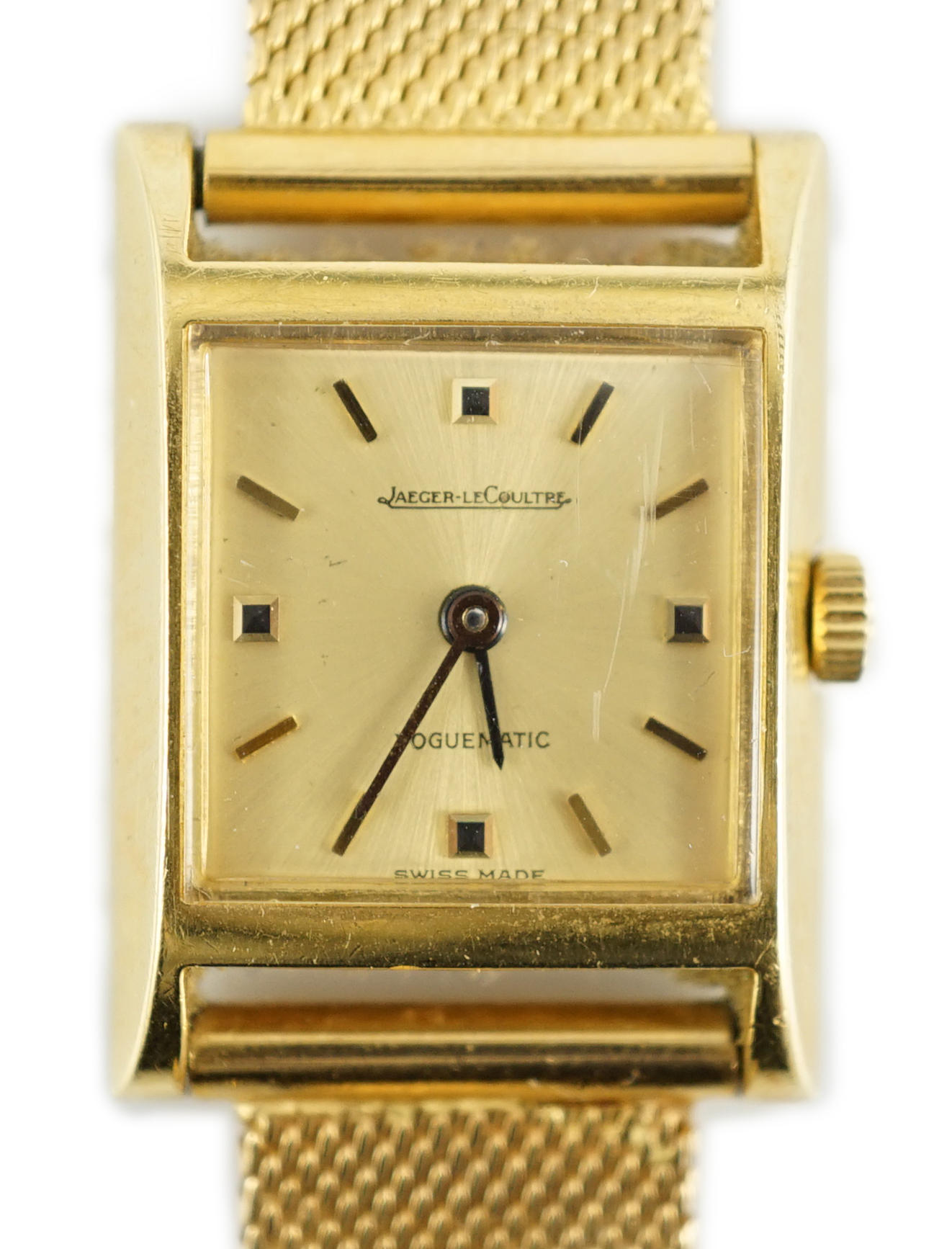 A lady's 18ct gold Jaeger LeCoultre Voguematic automatic rectangular wrist watch, on an associated Middle Eastern gold mesh link bracelet